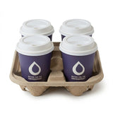 Four coffee cups in Zeropac 4-cup recycled pulp carrier at cafe