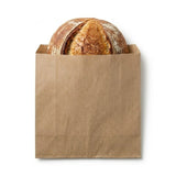 Zeropac 4F Kraft Flat Paper Bag holding an artisan sourdough loaf