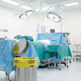 Zeropac Clinical Waste Bag in yellow pedal bin in pharmacy with staff
