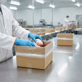 Food handler packing meat into Zeropac water-soluble carton liner in facility
