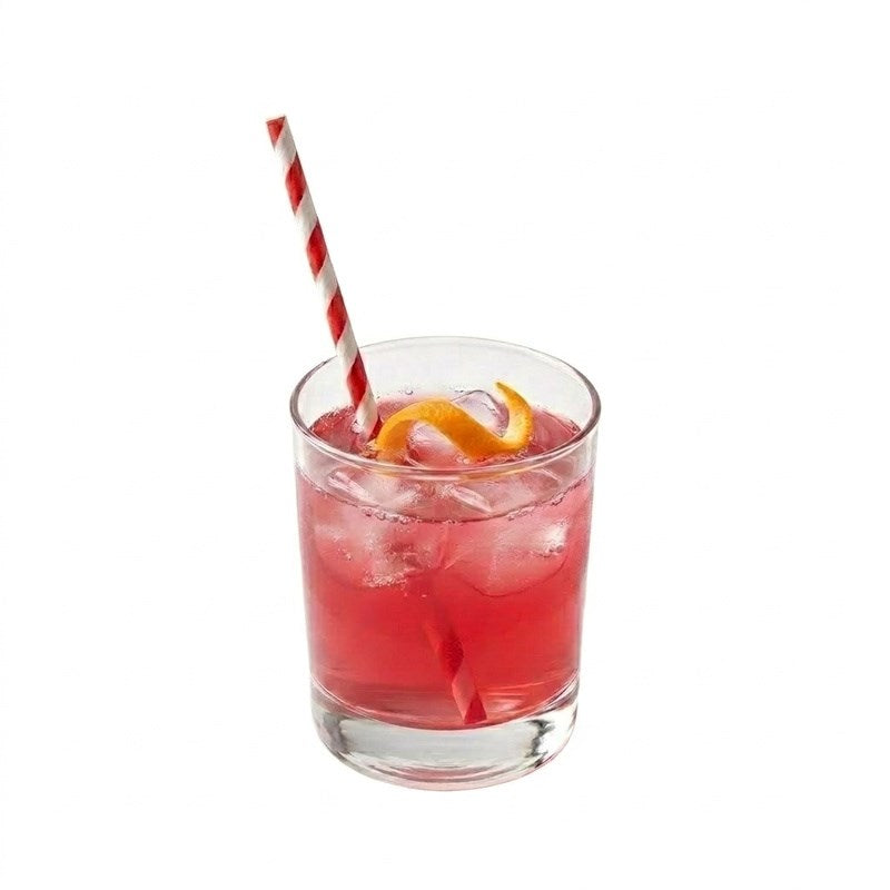 Red striped paper straw in fruity cocktail with orange slice