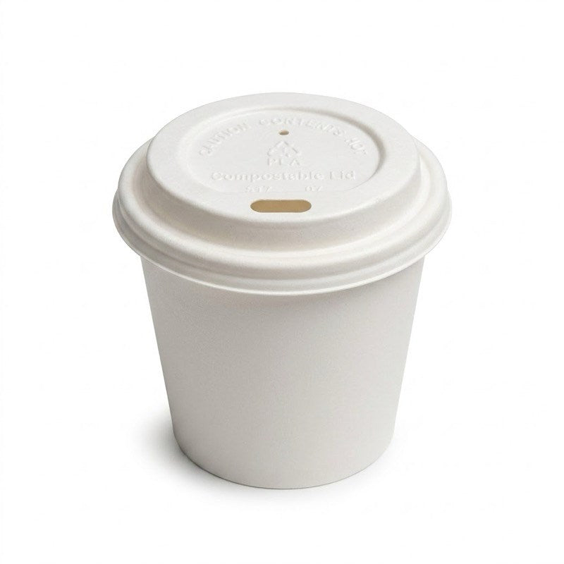 White coffee cup with Zeropac CPLA Coffee Cup Lid 4oz on wooden cafe counter