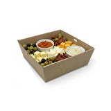 Zeropac kraft catering tray holding charcuterie board with cheeses, cured meats, olives, and dips