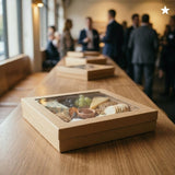 Kraft catering tray with cheese, meats and crackers displayed at event venue