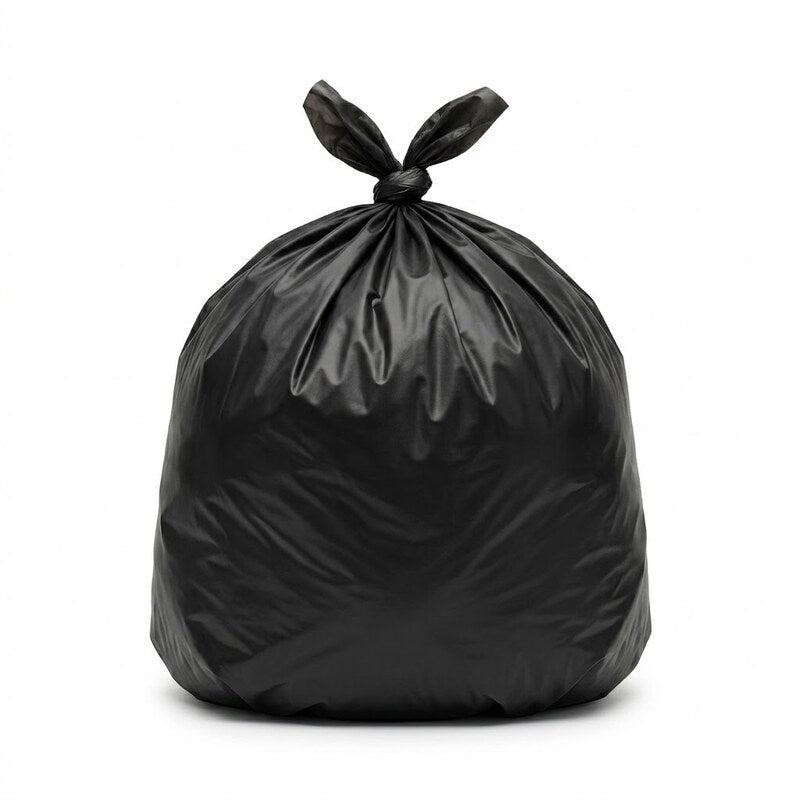 Worker disposing food waste in Zeropac 82 litre black bin liner