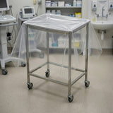 Clear disposable drape sheet in use on medical equipment in clinical facility
