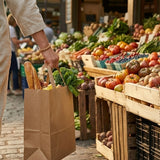 Shopper with Zeropac Paper Bag Flat Handle Large carrying fresh produce at an outdoor market