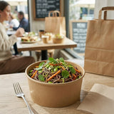 Noodle bowl in Zeropac container at cafe with kraft paper bag