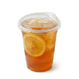Zeropac PET straw-free dome lid holding iced tea with fresh lemon slice